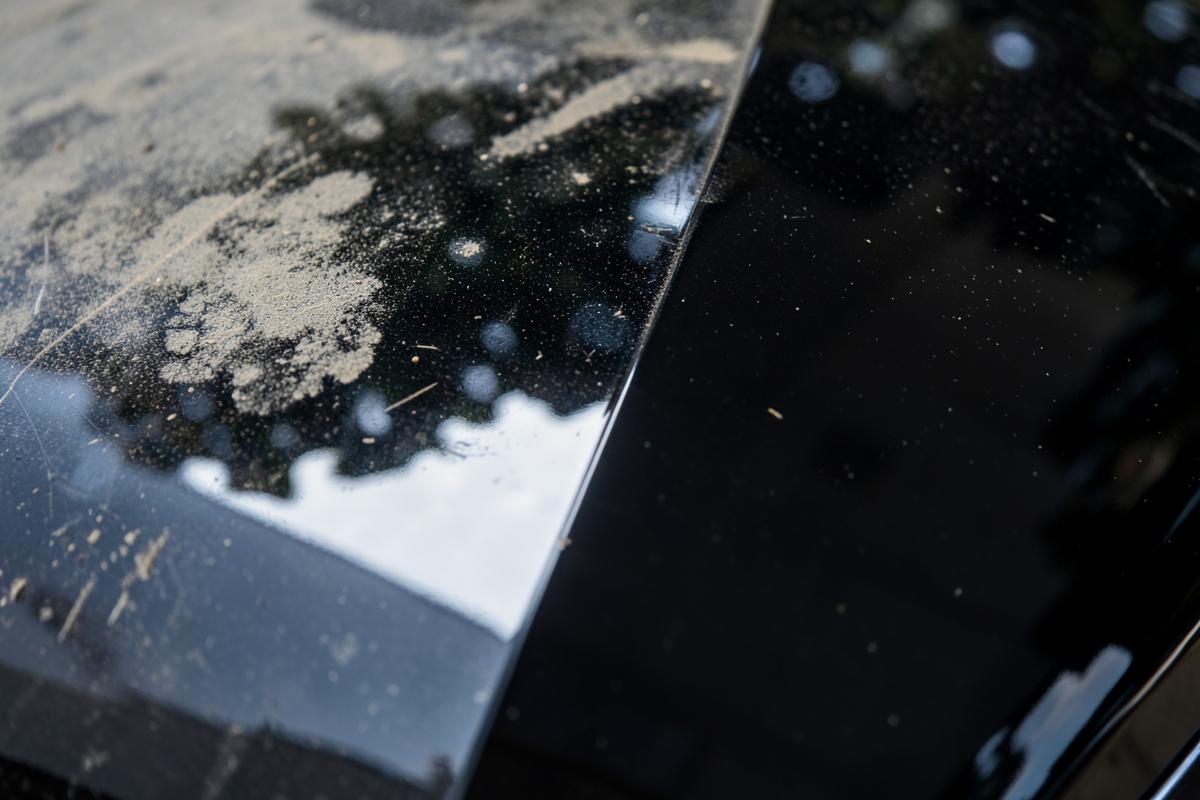 Car bonnet shown dusty on one side and freshly polished on the other